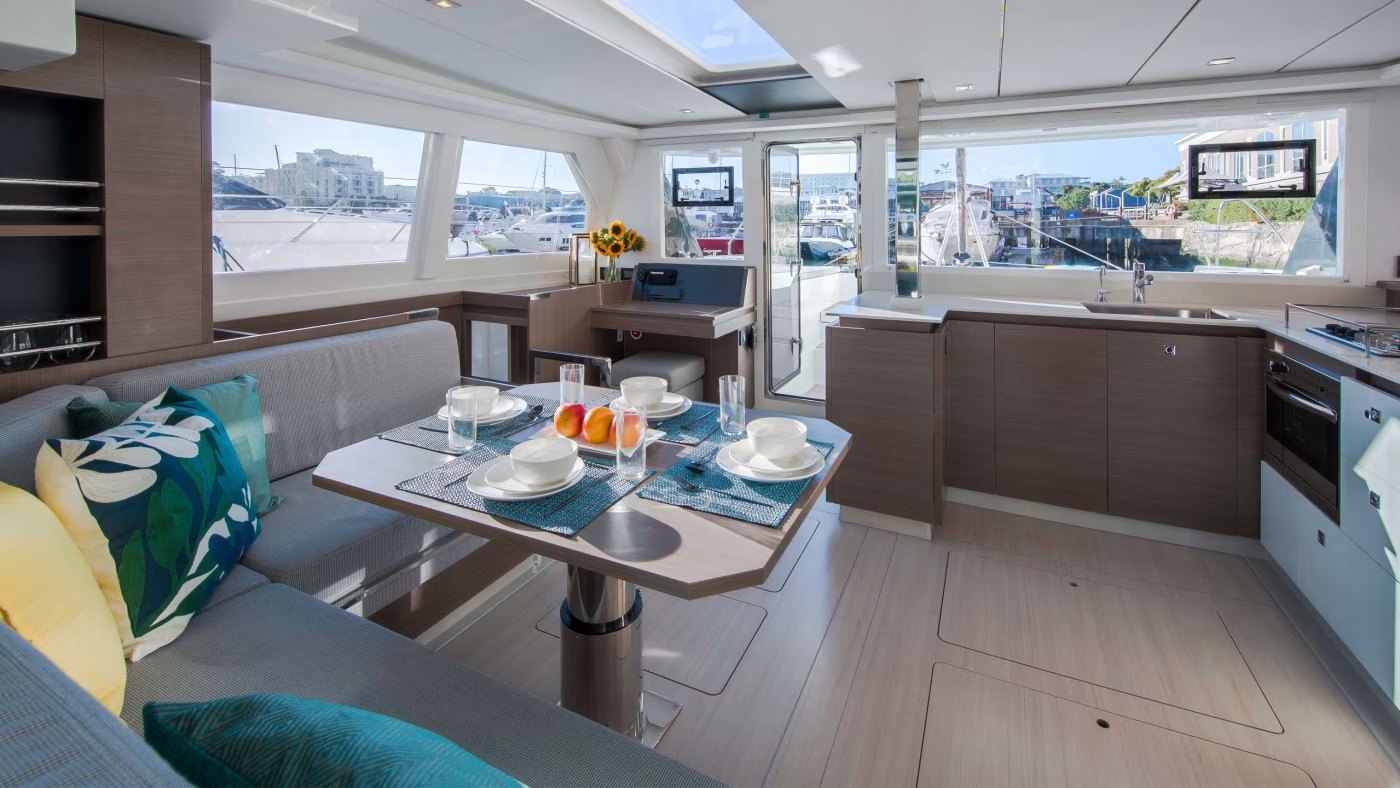 Interior saloon, dining area, and galley of the Leopard 42